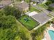 Aerial view of community playground with turf and nearby pool at 15037 Cedar Branch Way, Orlando, FL 32824