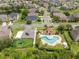 Aerial view of the community pool, playground, and surrounding neighborhood at 15037 Cedar Branch Way, Orlando, FL 32824