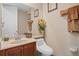Well-lit powder room with elegant fixtures, a decorative mirror, and neutral tones for a clean and welcoming space at 15037 Cedar Branch Way, Orlando, FL 32824