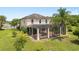 Spacious two-story home featuring a screened-in patio and a well-maintained backyard at 15037 Cedar Branch Way, Orlando, FL 32824