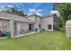 Spacious backyard with a patio, perfect for outdoor entertaining at 1651 Windsor Oak Ct, Kissimmee, FL 34744