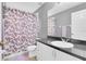 Bathroom featuring a full-sized mirror, vanity, and shower with butterfly-themed curtains at 1651 Windsor Oak Ct, Kissimmee, FL 34744