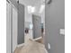 Hallway providing seamless flow to the kitchen and dining area of the home at 1651 Windsor Oak Ct, Kissimmee, FL 34744
