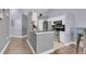 Modern kitchen with stainless steel appliances, white cabinets, and stylish countertops at 1651 Windsor Oak Ct, Kissimmee, FL 34744