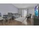 Cozy living room with a comfortable couch and a sliding glass door at 1651 Windsor Oak Ct, Kissimmee, FL 34744