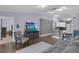 Open-concept living room with hardwood floors and plenty of natural light at 1651 Windsor Oak Ct, Kissimmee, FL 34744