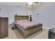 Bright bedroom featuring a ceiling fan, walk-in closet, and ample space at 1651 Windsor Oak Ct, Kissimmee, FL 34744