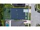 Aerial view of the property showcasing the home's layout, roof, and fenced backyard at 1723 Brassie Ct, Kissimmee, FL 34746
