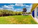 Generous backyard with tropical landscaping offers privacy and a serene outdoor space at 1723 Brassie Ct, Kissimmee, FL 34746