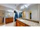 Bathroom features double sinks, granite countertops, and walk-in shower at 1723 Brassie Ct, Kissimmee, FL 34746