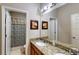 Bright bathroom with a double sink vanity featuring granite countertop and a shower/tub combination at 1723 Brassie Ct, Kissimmee, FL 34746