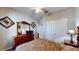 Bedroom with ceiling fan, dresser, and a double closet, creating a comfortable and functional space at 1723 Brassie Ct, Kissimmee, FL 34746
