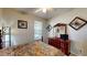 Bedroom with ceiling fan, dresser with mirror, and decorative wall hangings, creating a relaxing atmosphere at 1723 Brassie Ct, Kissimmee, FL 34746
