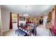 Dining area featuring a table, flowing into the living room and kitchen at 1723 Brassie Ct, Kissimmee, FL 34746