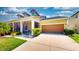 Inviting single-Gathering house with a screened porch and a well-kept front yard at 1723 Brassie Ct, Kissimmee, FL 34746