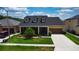 Charming single-Gathering home with a well-maintained lawn and landscaped garden at 1723 Brassie Ct, Kissimmee, FL 34746