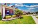 Beautiful landscaping and a screened porch enhance the curb appeal of this lovely home at 1723 Brassie Ct, Kissimmee, FL 34746