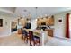 Open concept kitchen with granite countertops and an island with seating for casual dining at 1723 Brassie Ct, Kissimmee, FL 34746