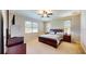 Bright main bedroom with large windows, ceiling fan, and ample space at 1723 Brassie Ct, Kissimmee, FL 34746