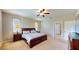 Cozy main bedroom with side tables, lamps and large windows at 1723 Brassie Ct, Kissimmee, FL 34746