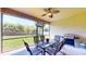 Screened patio with a ceiling fan and outdoor furniture, perfect for relaxing at 1723 Brassie Ct, Kissimmee, FL 34746