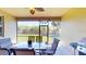 Relaxing screened-in patio with dining and lounge area, plus a barbecue grill at 1723 Brassie Ct, Kissimmee, FL 34746