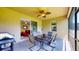 Inviting outdoor patio with ceiling fan, barbecue grill, and ample seating for dining and relaxing at 1723 Brassie Ct, Kissimmee, FL 34746