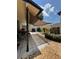 Cozy back patio featuring a shade sail and landscaping, great for outdoor enjoyment at 1844 Townhall Ln # 1844, Orlando, FL 32807