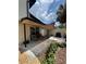 Back patio with shade sail, perfect for enjoying outdoor living and dining at 1844 Townhall Ln # 1844, Orlando, FL 32807