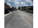 Community street view showcasing the carport parking at 1844 Townhall Ln # 1844, Orlando, FL 32807