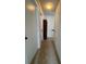 Hallway with tiled floor leading to multiple doors at 1844 Townhall Ln # 1844, Orlando, FL 32807