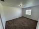 Neutral bedroom with a large window and neutral carpeting at 198 N Lake Ct, Kissimmee, FL 34743