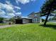 Charming two-story home featuring an attached two car garage and a beautifully landscaped yard at 198 N Lake Ct, Kissimmee, FL 34743