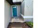 View of a charming front door with decorative glass and tile entryway at 198 N Lake Ct, Kissimmee, FL 34743