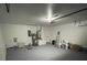 Spacious garage featuring epoxy flooring and ample space for storage at 198 N Lake Ct, Kissimmee, FL 34743