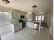 Updated kitchen featuring stainless steel appliances and updated countertops at 198 N Lake Ct, Kissimmee, FL 34743