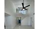 Open-concept living space featuring tile floors and soaring ceilings at 198 N Lake Ct, Kissimmee, FL 34743