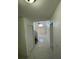 Upstairs hallway leading to the living area, showcasing modern tile floors at 198 N Lake Ct, Kissimmee, FL 34743