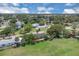 Expansive aerial view showcasing the property's location within a serene, tree-lined neighborhood at 203 Parkwood Ln, Edgewater, FL 32132