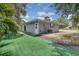 Charming single-story home with a well-maintained yard and mature palm trees, perfect for Florida living at 203 Parkwood Ln, Edgewater, FL 32132
