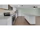 Modern kitchen with white cabinets, stainless steel appliances, and a large island perfect for entertaining at 203 Parkwood Ln, Edgewater, FL 32132