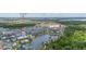 Aerial view of the community, highlighting Island Village clubhouse and a lake at 2057 Celebration Blvd, Kissimmee, FL 34747
