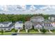 Street view of a two-story house with manicured front yard landscaping and a red pin on the roof at 2057 Celebration Blvd, Kissimmee, FL 34747