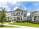 Charming two-story home with a cozy front porch and well-maintained landscaping at 2057 Celebration Blvd, Kissimmee, FL 34747