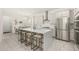 Modern kitchen with white cabinets, quartz countertops, and stainless steel appliances at 2057 Celebration Blvd, Kissimmee, FL 34747
