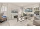 Bright living room with a fireplace, neutral tones, and large windows at 2057 Celebration Blvd, Kissimmee, FL 34747