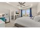 Bright main bedroom featuring a tray ceiling, white walls, and a dressing table at 2057 Celebration Blvd, Kissimmee, FL 34747