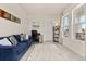Comfortable home office with a blue couch and large windows at 2057 Celebration Blvd, Kissimmee, FL 34747