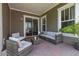 Covered patio features stylish outdoor seating and string lights at 2057 Celebration Blvd, Kissimmee, FL 34747