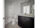 Bathroom with a tub and shower combo, dark vanity, and modern fixtures at 2164 Crosston Cir, Orlando, FL 32824